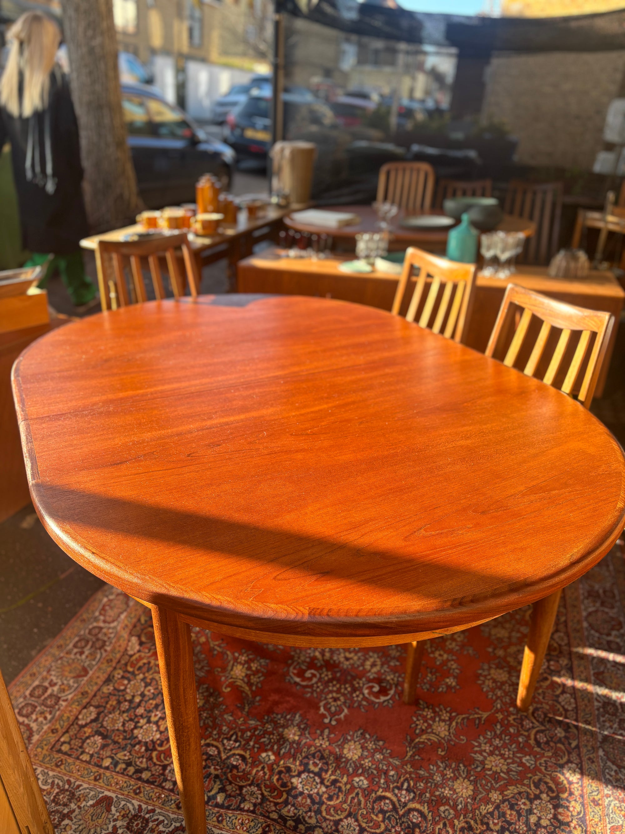 Mid Century early G-Plan teak extendable table and chairs with black vinyl