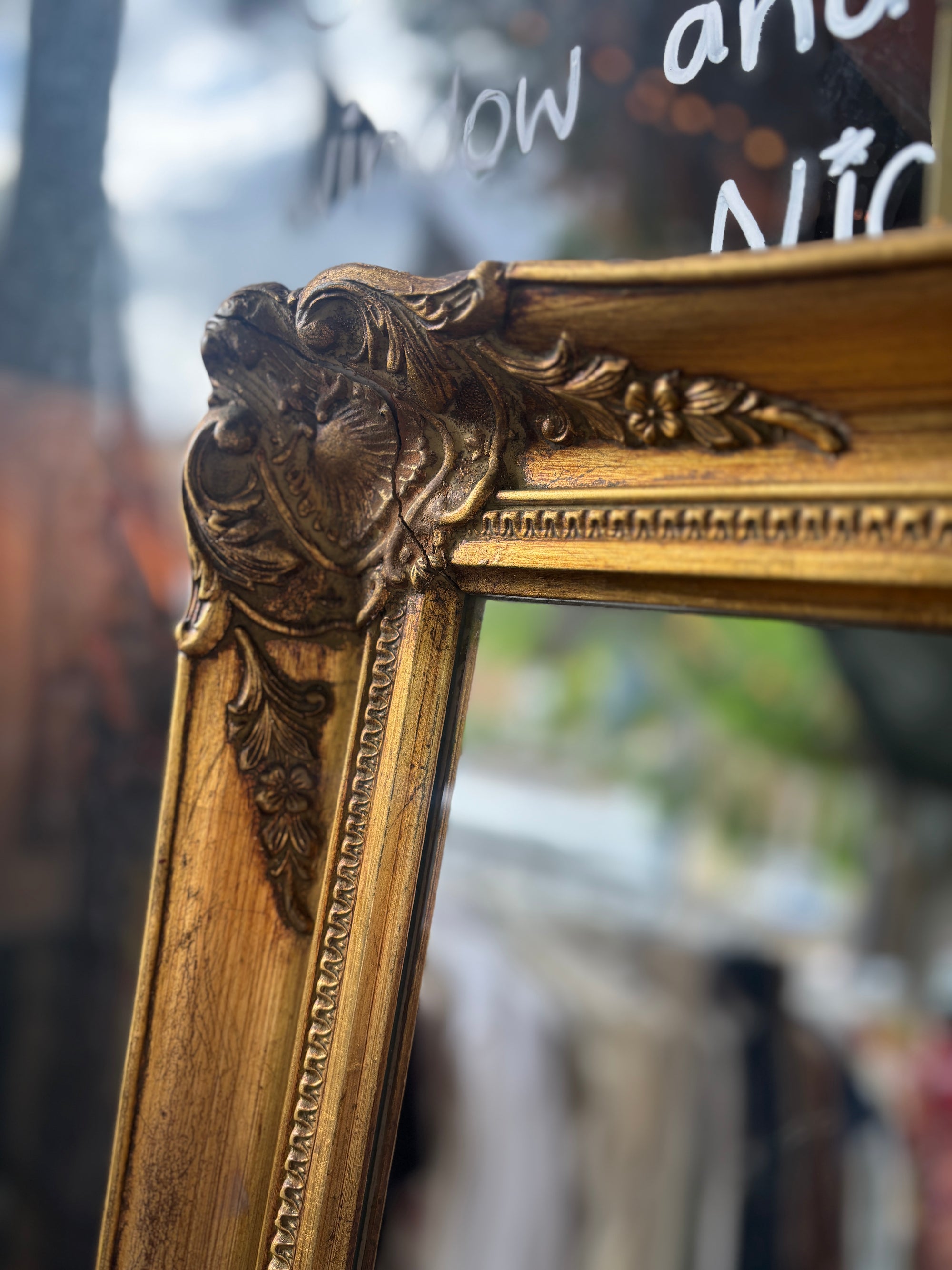 Vintage distressed baroque style gilt mirror