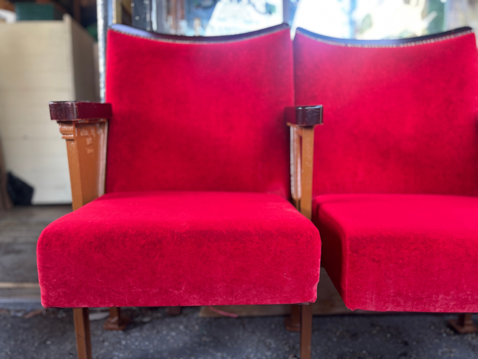 Art Deco red velvet and cast iron theatre chairs