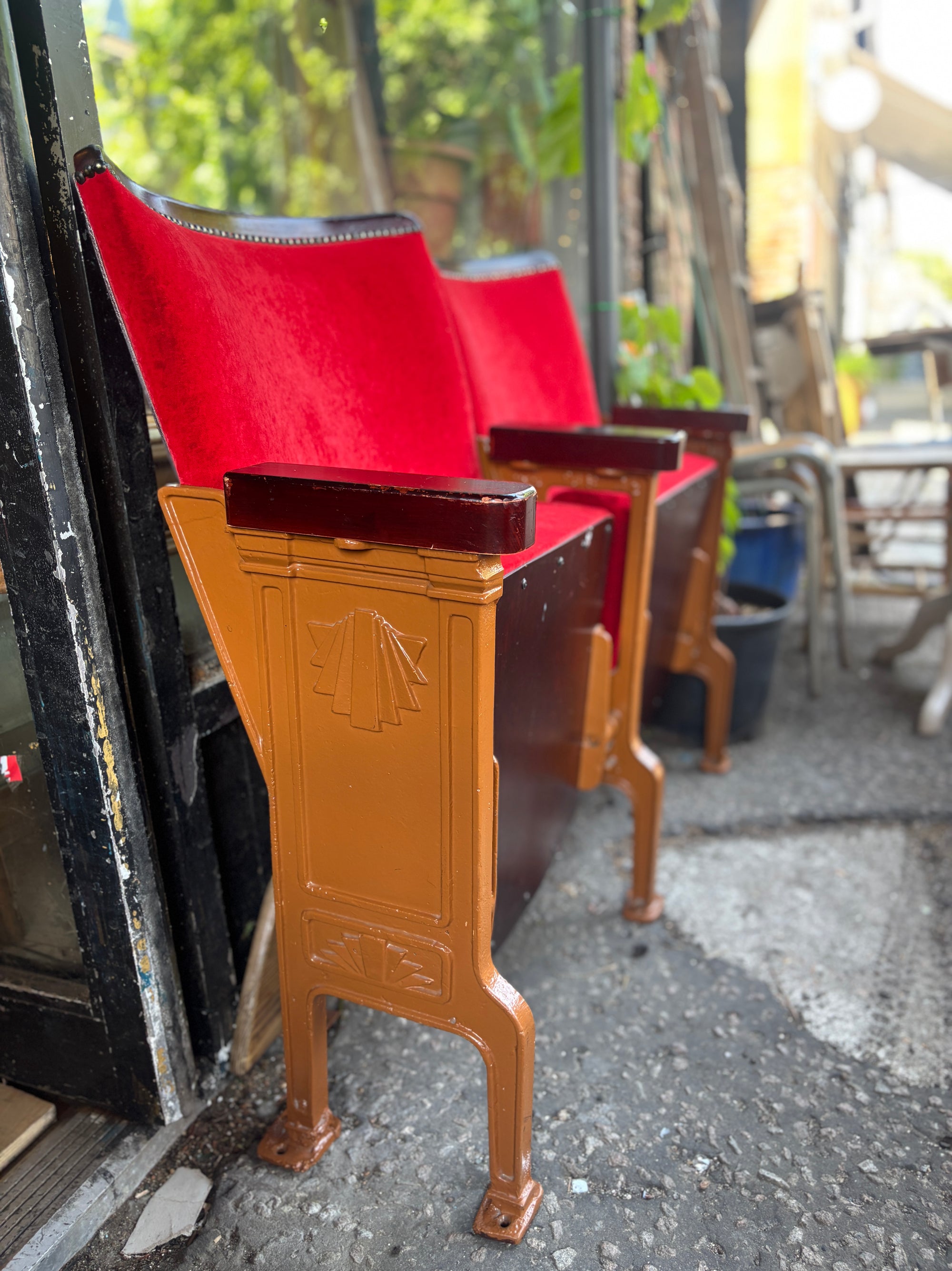 Art Deco red velvet and cast iron theatre chairs