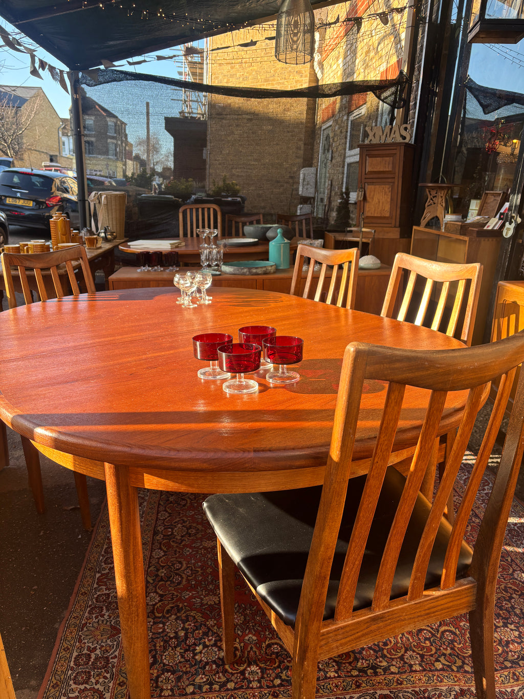Mid Century early G-Plan teak extendable table and chairs with black vinyl